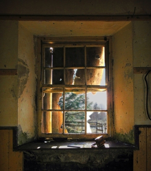 The light shines through the simple sash square headed window of Réidh Reamhar (Reyrawer) National School, Reyrawer townland, Co. Galway. This school house, built in 1883 is located high in the Slieve Aughty Mountains in Co. Galway. It is reported as the highest school house in Ireland